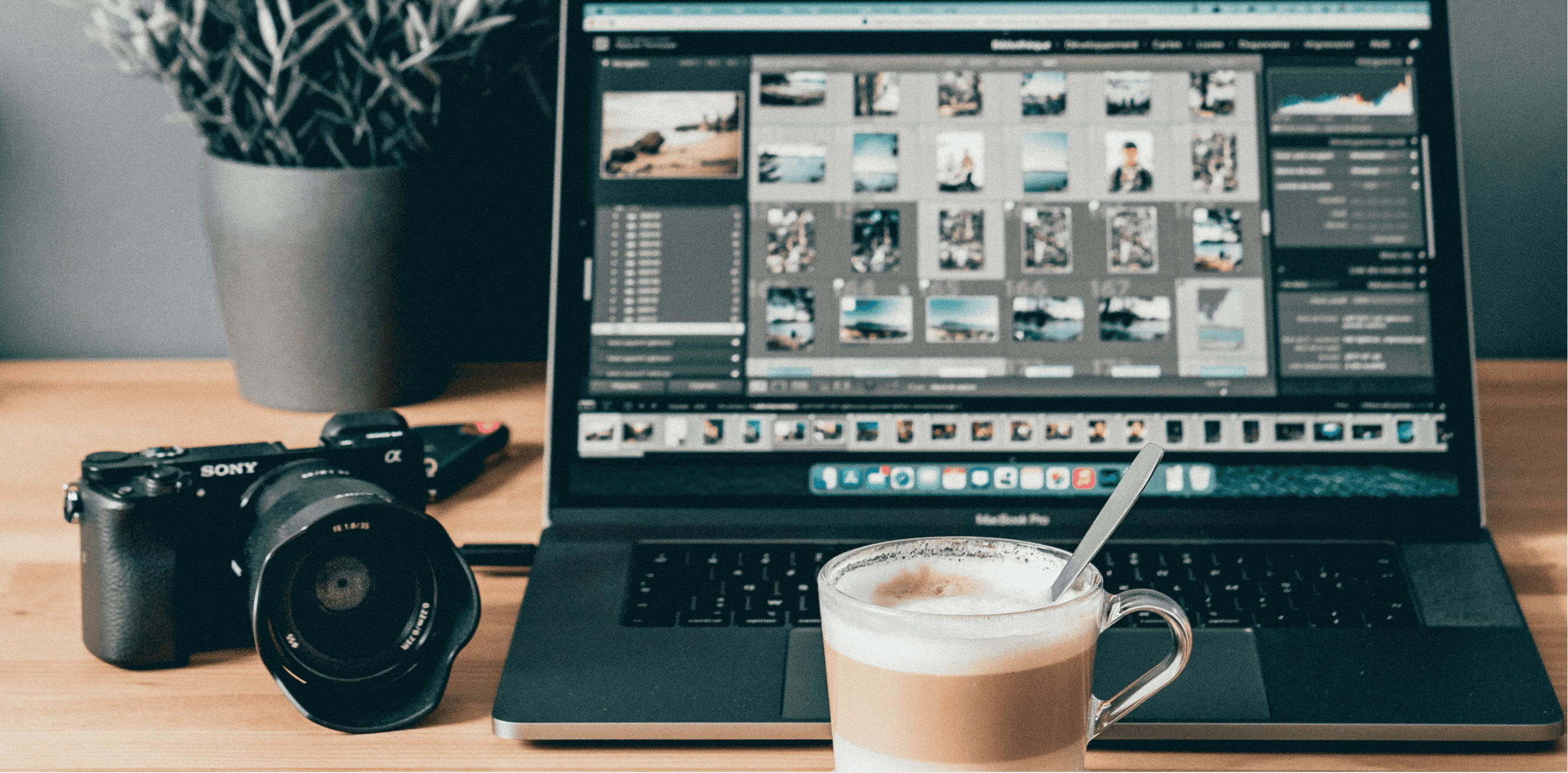 Blog cover image of a laptop, camera and coffee on a desk.